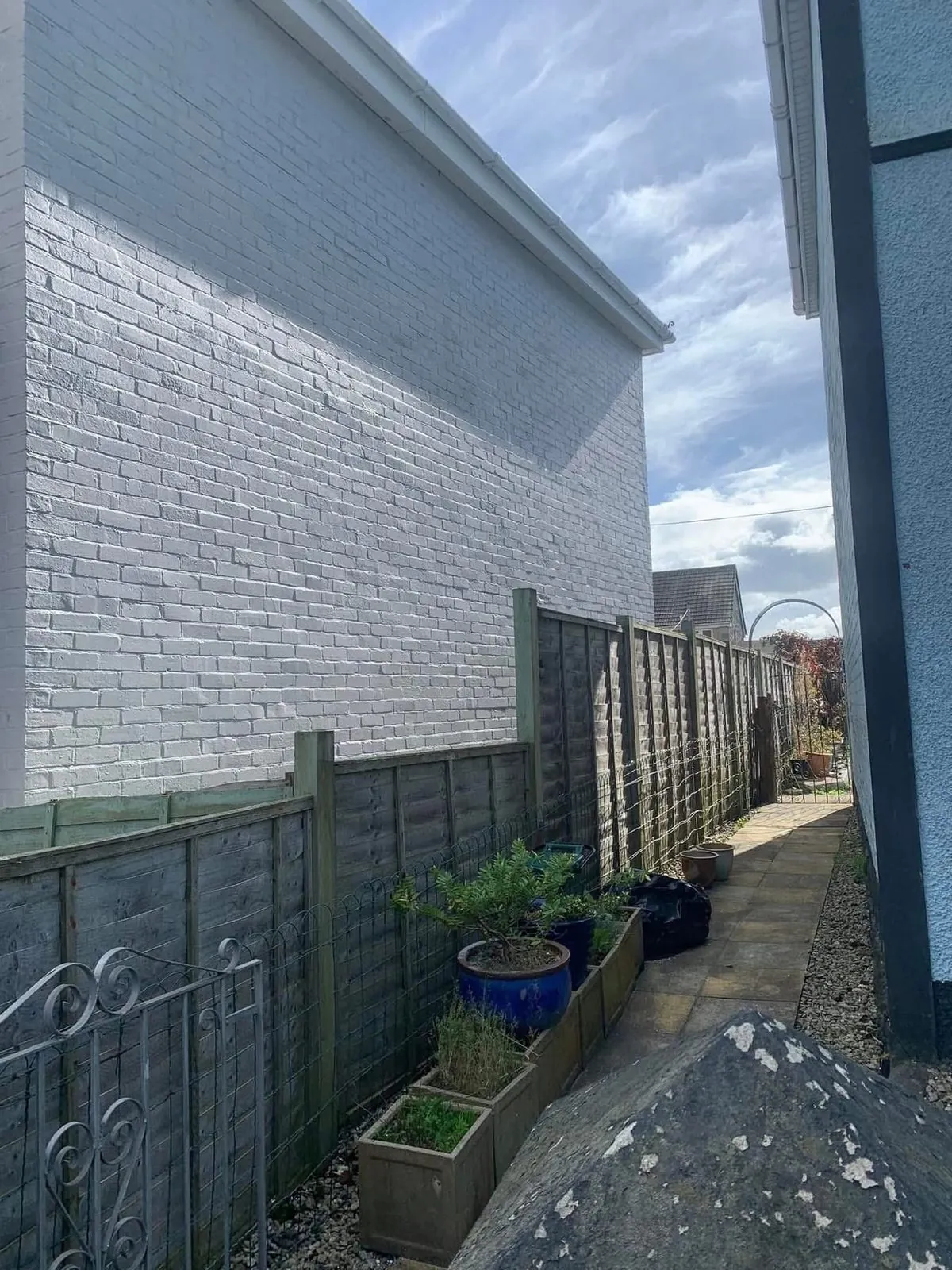 Freshly painted brick wall after preparation and masonry paint in Charlestown